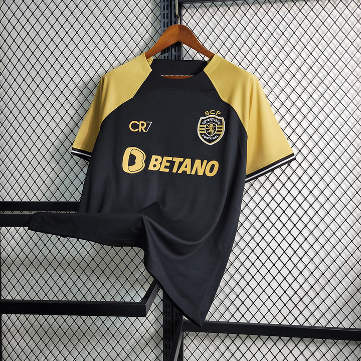 Camisa Sporting CP x CR7 23/24 Torcedor Masculina - Preto e Dourado